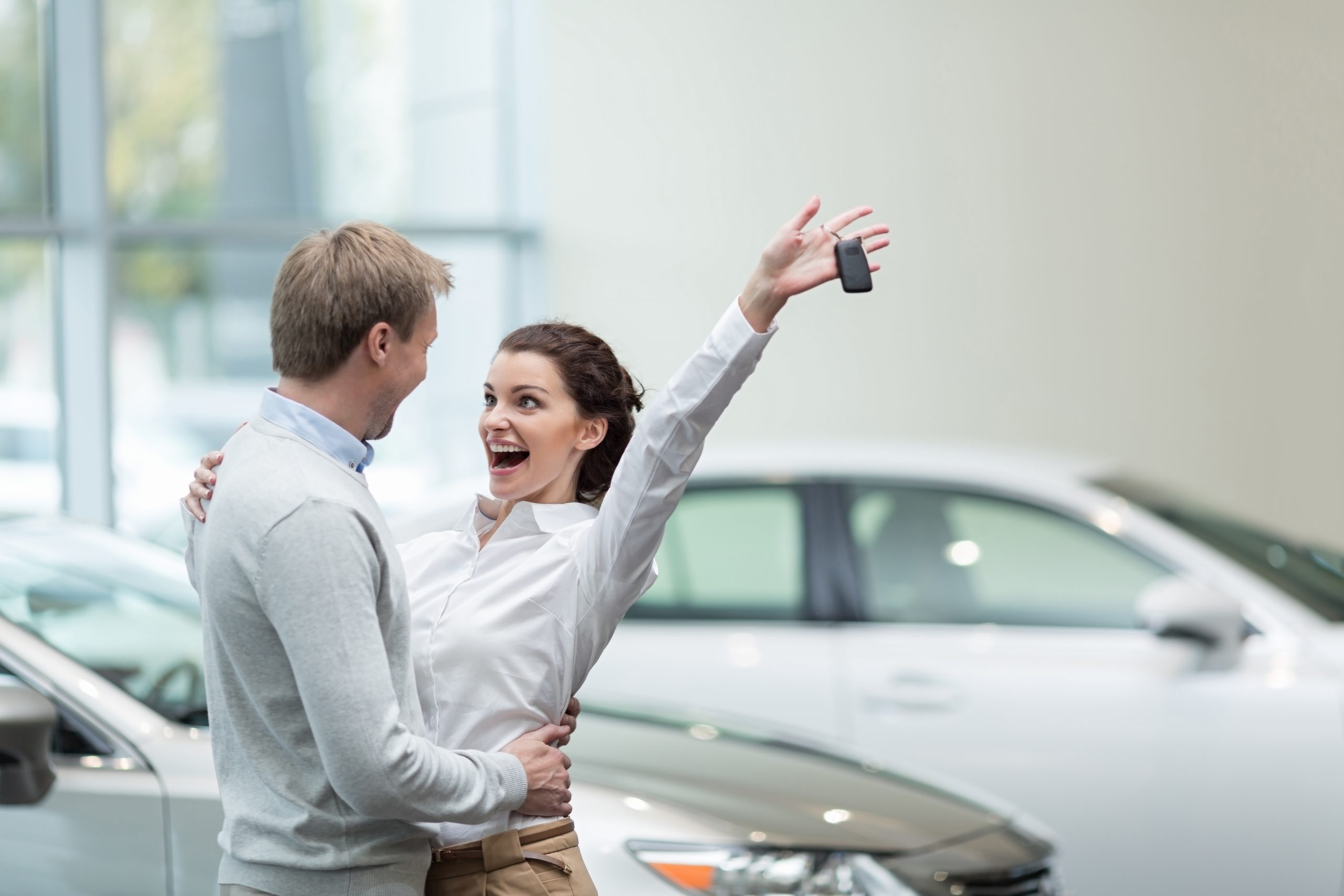 Embracing,Couple,With,Car,Keys